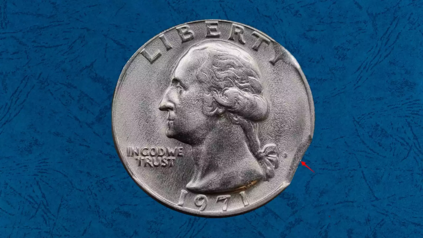 1971 Washington quarter struck on wrong planchet showing smaller diameter and truncated design elements compared to a standard quarter